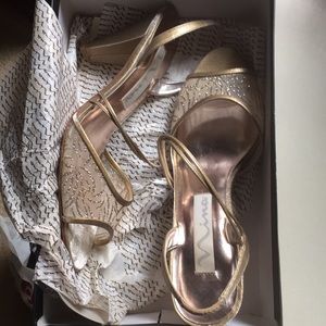 Gold/Doral 8 1/2 high heels.